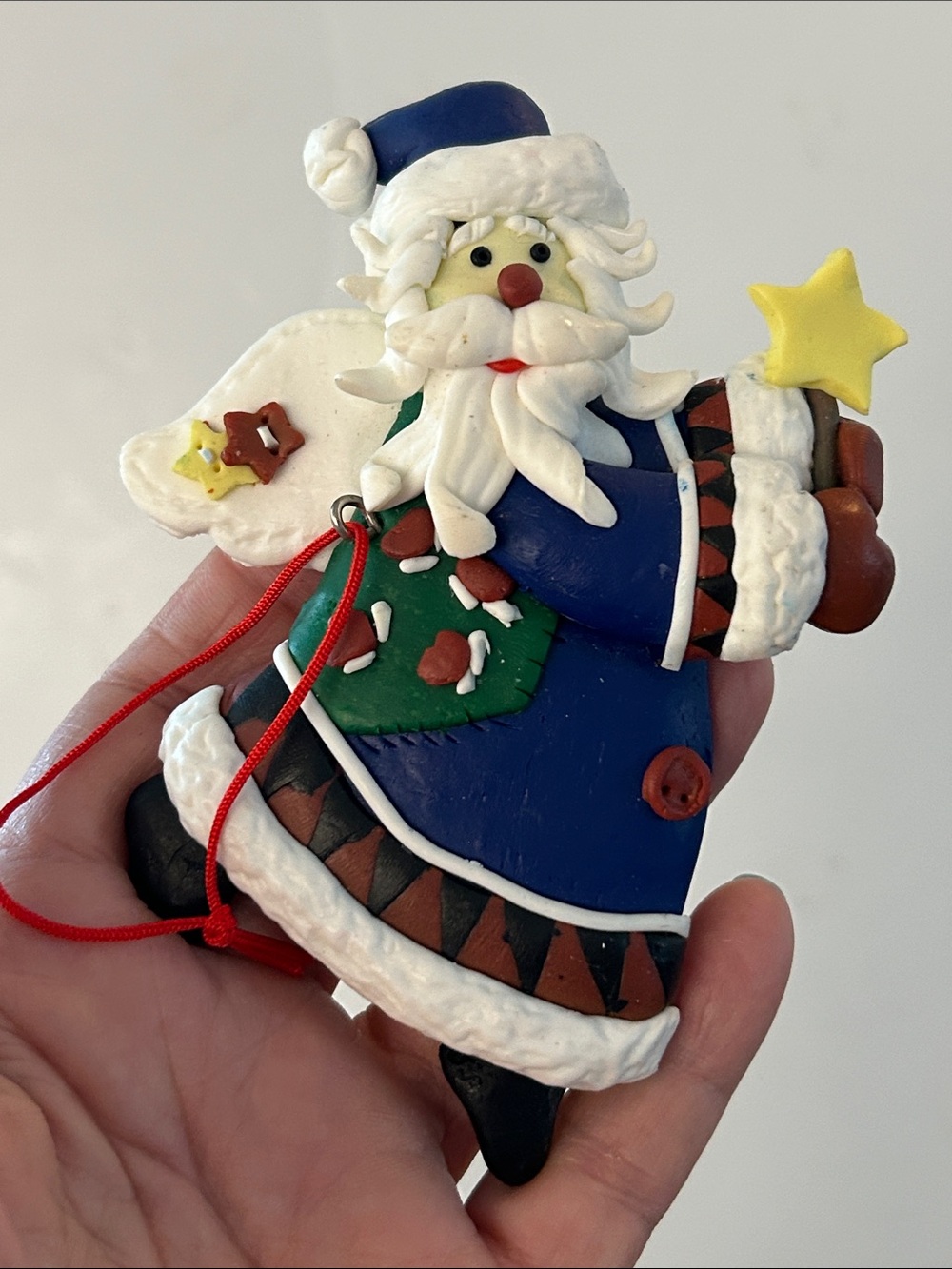 Dough Santa Christmas tree ornament blue coat holding a yellow star